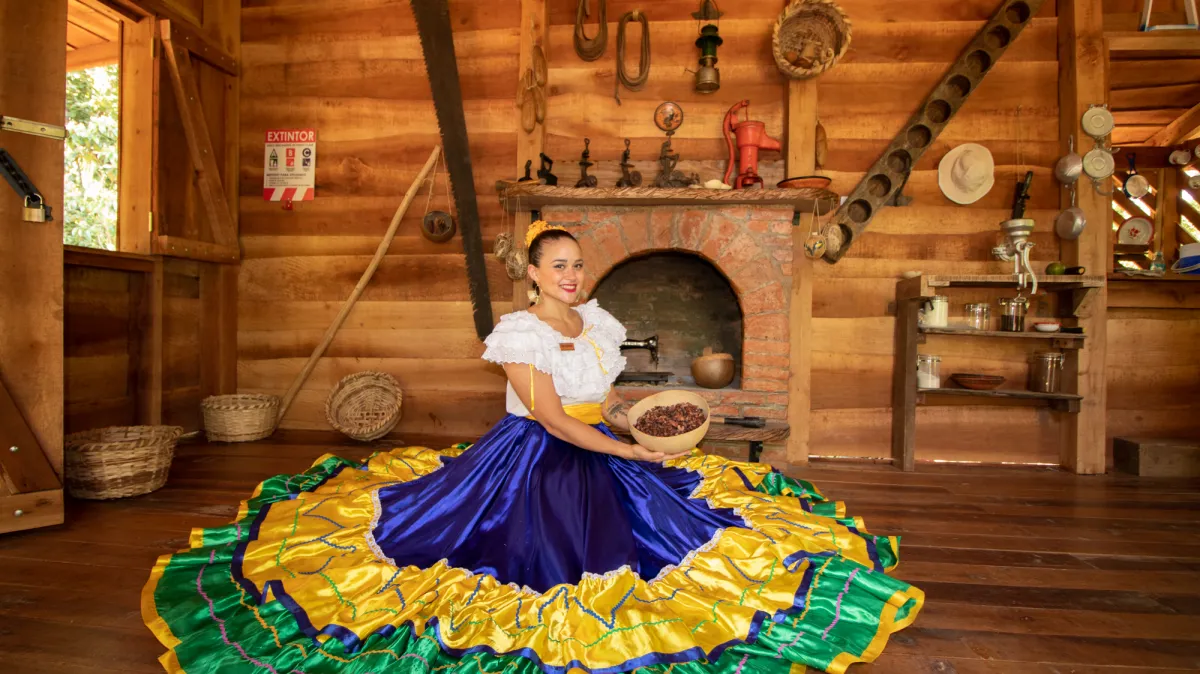 girl in a costa rican dress at traditional house